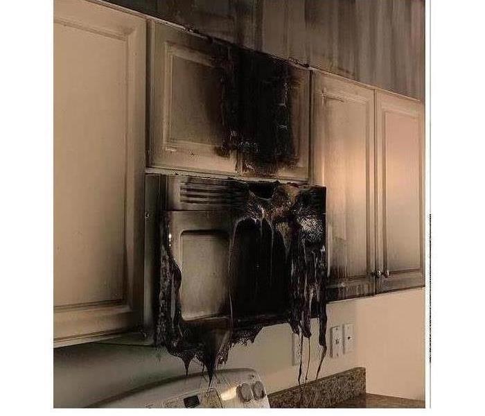 melted microwave and smoke damaged kitchen cabinets