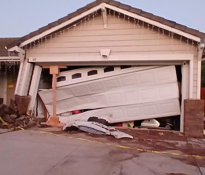 Garage Crashed into by vehicle; structural damage