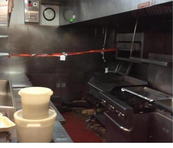 Kitchen fire damage in a Ventura restaurant showing soot and smoke damage