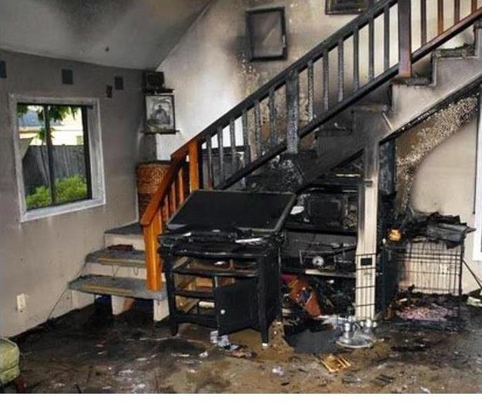 charred stairway and contents in a living room home