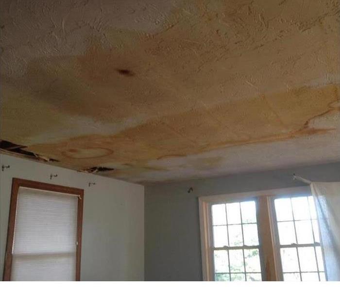 water damaged ceiling showing staining