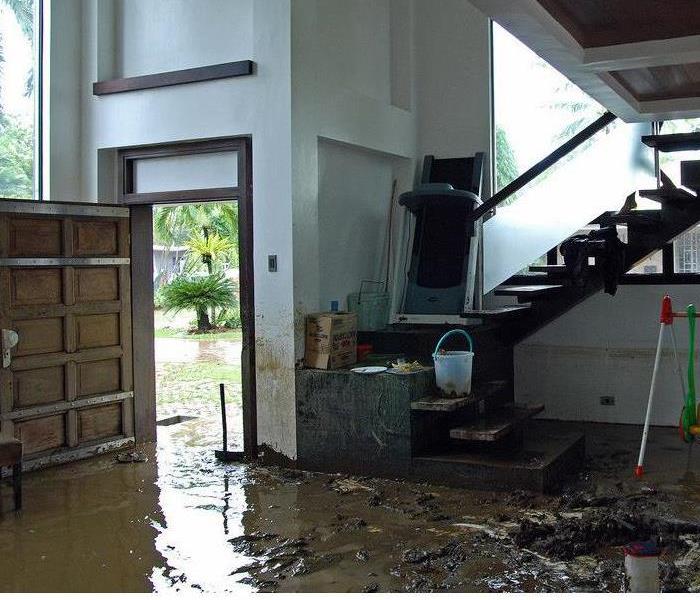 Flash flood ravaged home filled with mud and debris